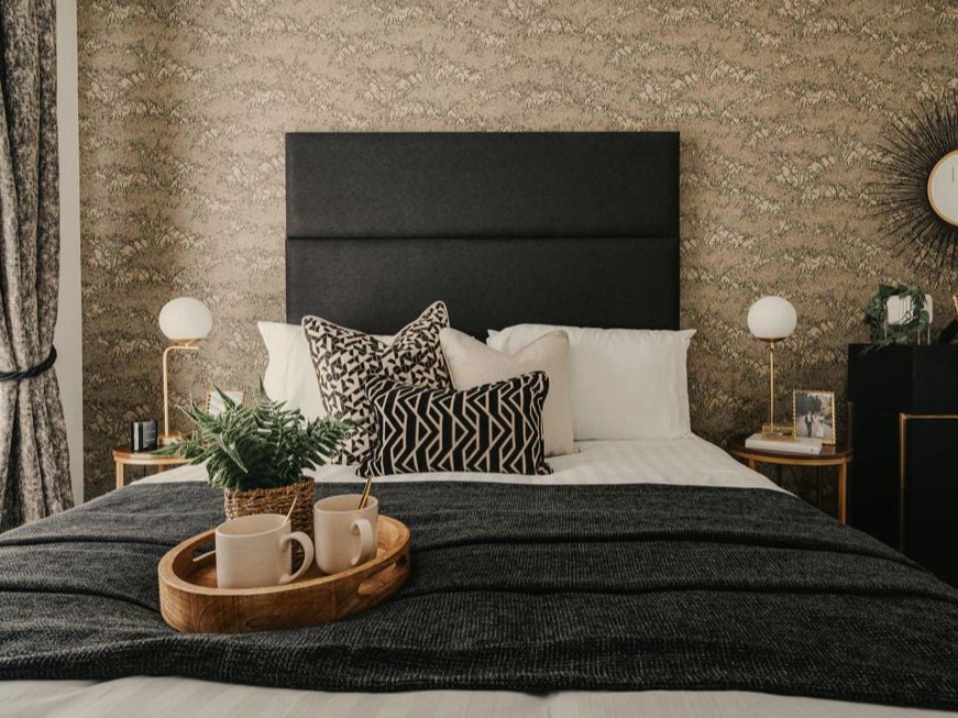 show home bedroom in black and beige
