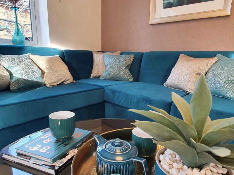 teal and soft gold showhome lounge